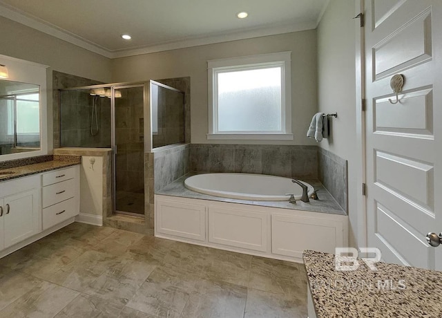 4844 E Cypress Loop, Orange Beach, AL 36561 - full bathroom featuring a shower stall, a garden tub, vanity, ornamental molding, and recessed lighting