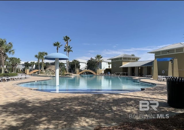 4844 E Cypress Loop, Orange Beach, AL 36561 - community pool featuring a patio