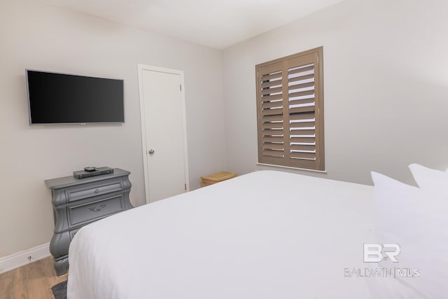 bedroom featuring hardwood / wood-style flooring