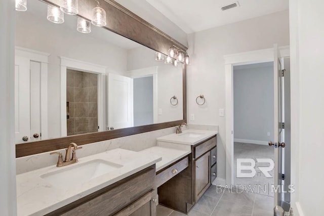 bathroom with tile patterned floors and vanity