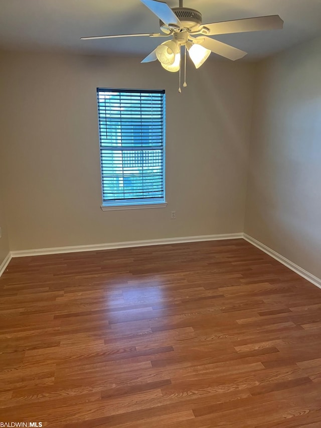 unfurnished room featuring wood-type flooring and ceiling fan