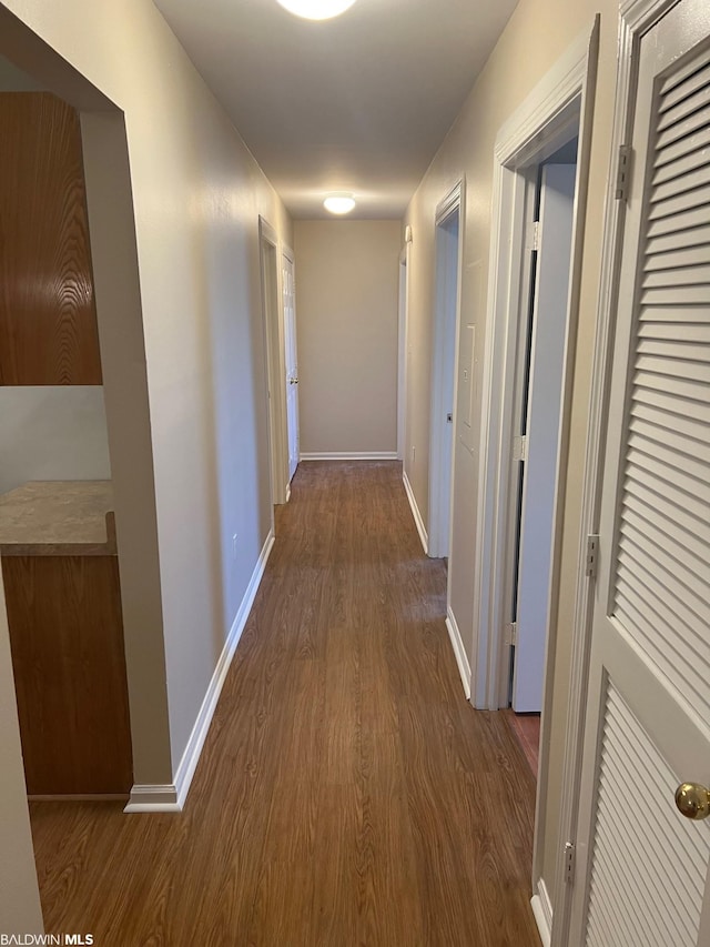 hallway featuring dark hardwood / wood-style floors