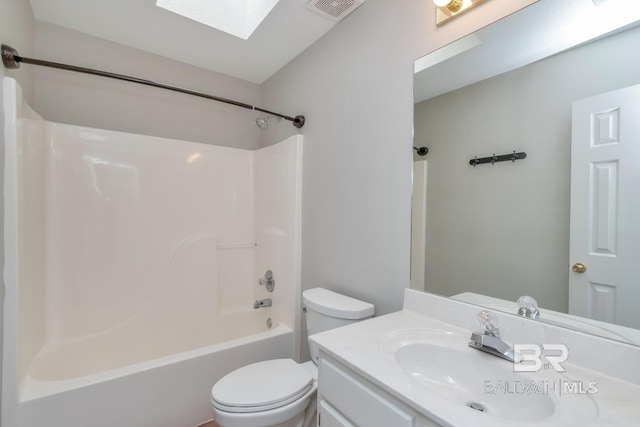 full bathroom featuring visible vents, a skylight, toilet, vanity, and shower / bathtub combination