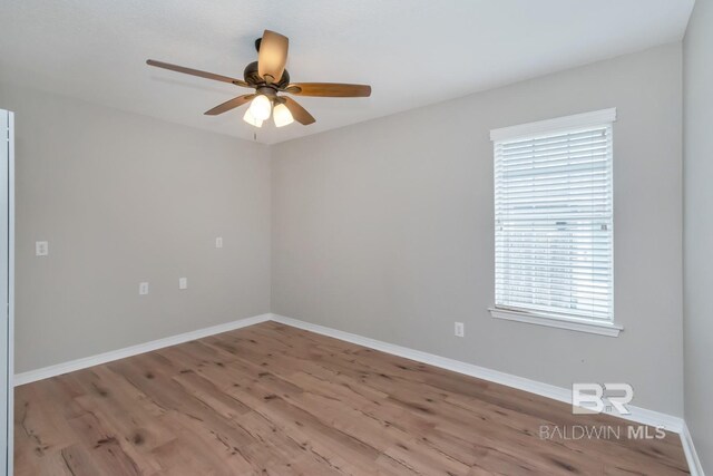 spare room featuring ceiling fan and light wood-type flooring