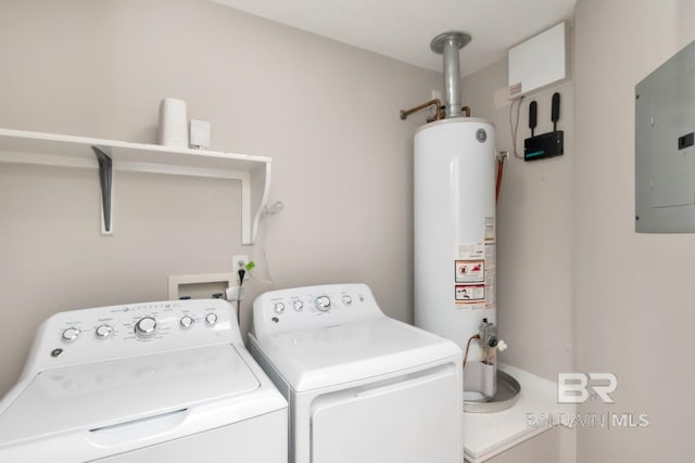 washroom featuring separate washer and dryer, electric panel, and gas water heater