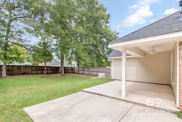 view of yard featuring a patio, a fenced backyard, and a ceiling fan