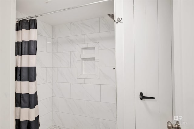 bathroom featuring curtained shower