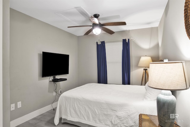 bedroom featuring ceiling fan and light hardwood / wood-style floors