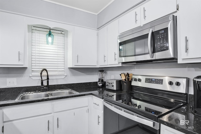 kitchen featuring sink, white cabinets, and stainless steel appliances