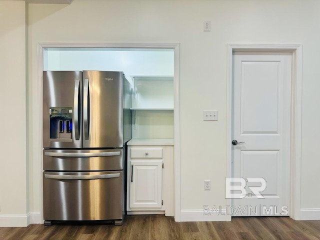 2663 Demetropolis Rd, Mobile, AL 36693 - kitchen with stainless steel refrigerator with ice dispenser, dark wood-style flooring, white cabinets, and light countertops