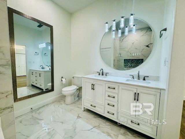 2663 Demetropolis Rd, Mobile, AL 36693 - bathroom featuring double vanity, marble look tile flooring, and a marble finish shower