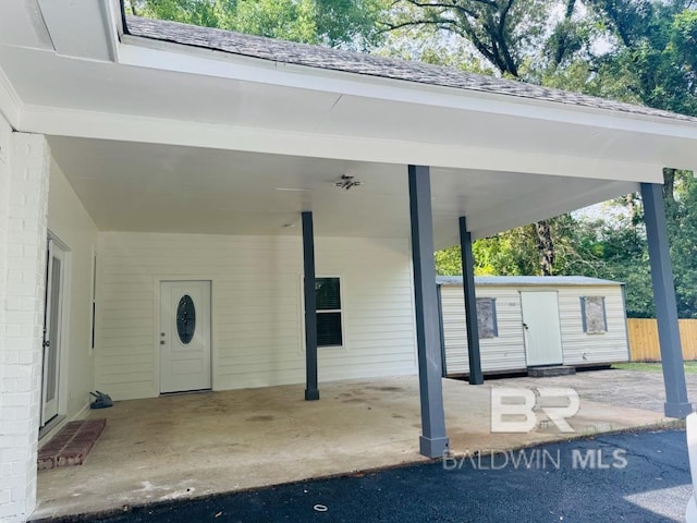 2663 Demetropolis Rd, Mobile, AL 36693 - doorway to property featuring an attached carport