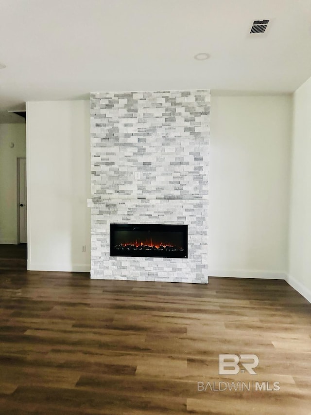 2663 Demetropolis Rd, Mobile, AL 36693 - unfurnished living room featuring wood finished floors and a fireplace