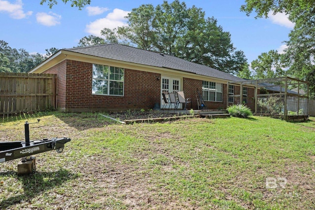 view of front of house featuring brick siding, french doors, and a wooden deck