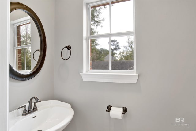 bathroom featuring sink and a wealth of natural light