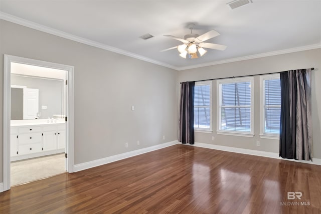 empty room with ceiling fan, crown molding, and wood-type flooring