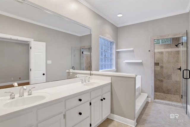 bathroom with ornamental molding, vanity, tile patterned floors, and a shower with shower door