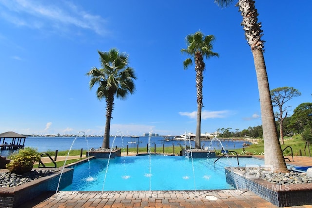 view of pool featuring a water view