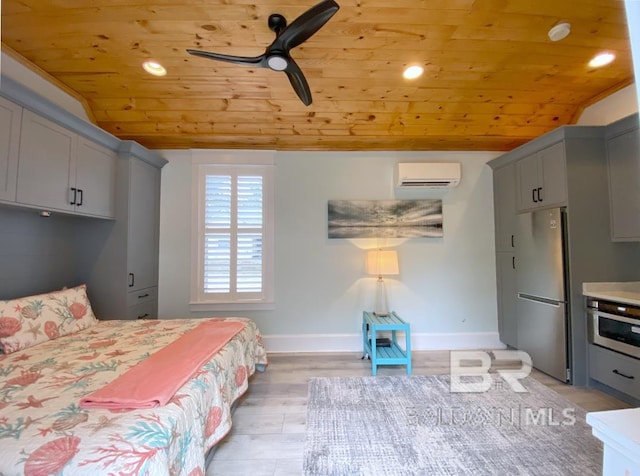 bedroom featuring a wall mounted air conditioner, baseboards, lofted ceiling, wooden ceiling, and freestanding refrigerator