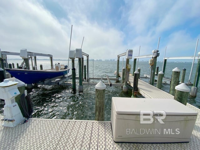 view of dock with a water view and boat lift