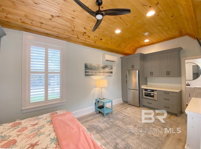 bedroom featuring a wall mounted AC, vaulted ceiling, light wood-type flooring, wooden ceiling, and freestanding refrigerator