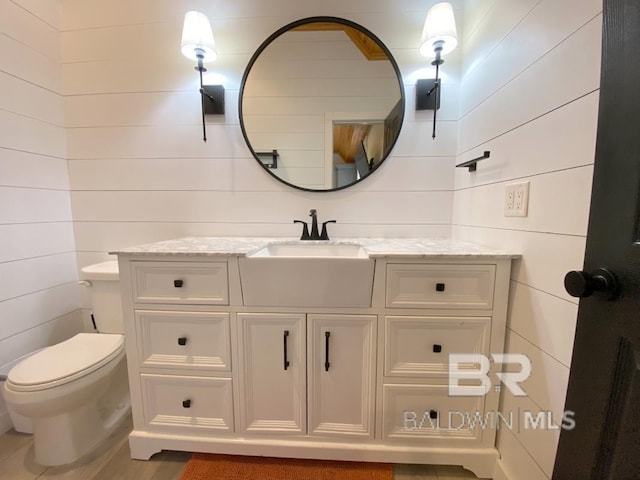 bathroom with toilet and vanity