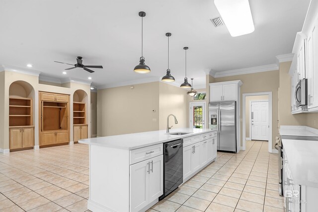 36 Lagoon Dr, Gulf Shores, AL 36542 - kitchen featuring light tile patterned floors, appliances with stainless steel finishes, light countertops, a sink, and a center island with sink