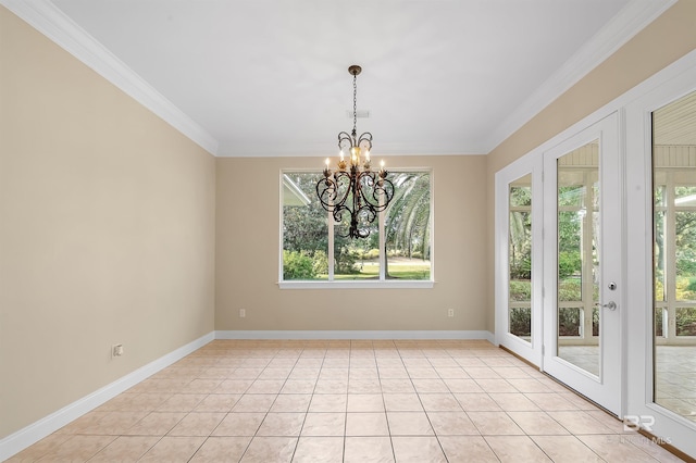 tiled spare room featuring a chandelier and ornamental molding