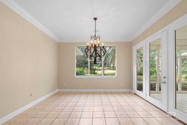 36 Lagoon Dr, Gulf Shores, AL 36542 - unfurnished dining area featuring a chandelier, light tile patterned floors, baseboards, and ornamental molding