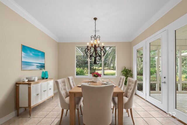 36 Lagoon Dr, Gulf Shores, AL 36542 - dining area with a notable chandelier, baseboards, ornamental molding, and light tile patterned flooring