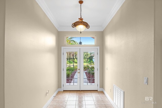36 Lagoon Dr, Gulf Shores, AL 36542 - entryway featuring baseboards, ornamental molding, light tile patterned floors, french doors, and visible vents