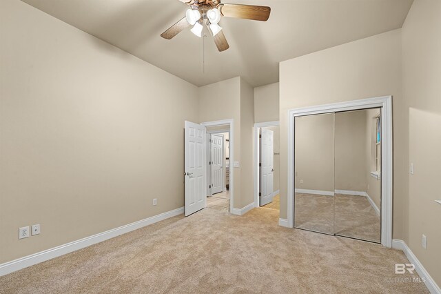 36 Lagoon Dr, Gulf Shores, AL 36542 - unfurnished bedroom with a closet, light colored carpet, and baseboards