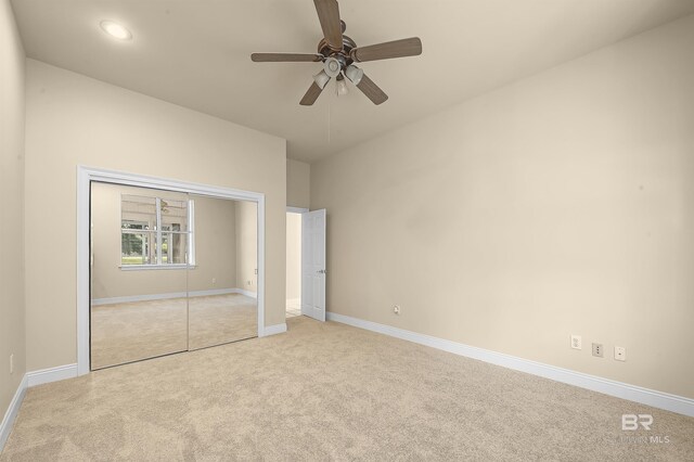 36 Lagoon Dr, Gulf Shores, AL 36542 - unfurnished bedroom with a closet, light colored carpet, baseboards, and recessed lighting
