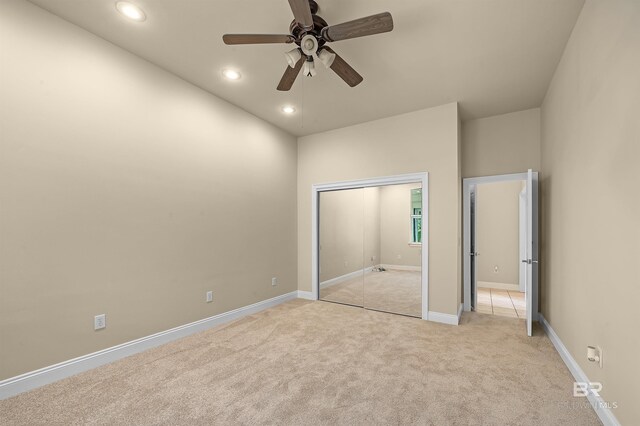 36 Lagoon Dr, Gulf Shores, AL 36542 - unfurnished bedroom with a closet, baseboards, recessed lighting, and light carpet
