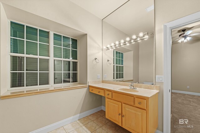 36 Lagoon Dr, Gulf Shores, AL 36542 - bathroom featuring tile patterned floors, baseboards, a ceiling fan, and vanity