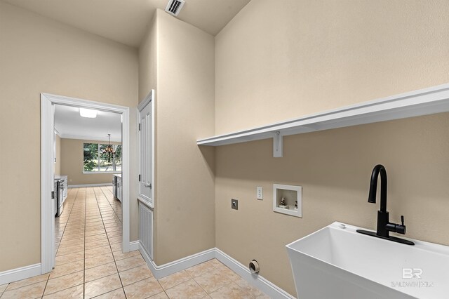 36 Lagoon Dr, Gulf Shores, AL 36542 - laundry area with visible vents, light tile patterned floors, washer hookup, a sink, and laundry area