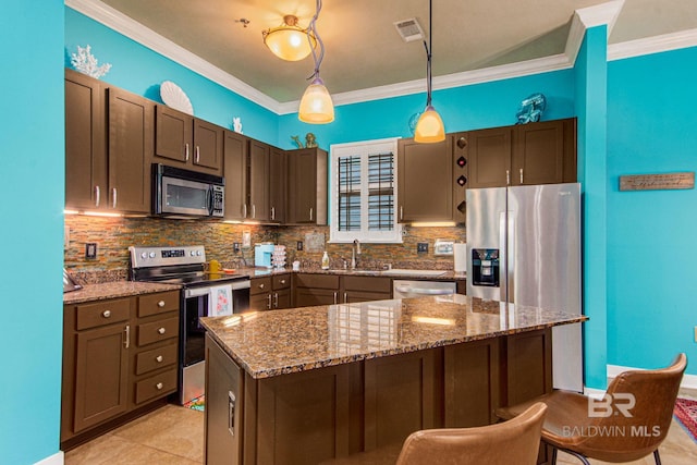 kitchen featuring hanging light fixtures, a center island, crown molding, stainless steel appliances, and sink