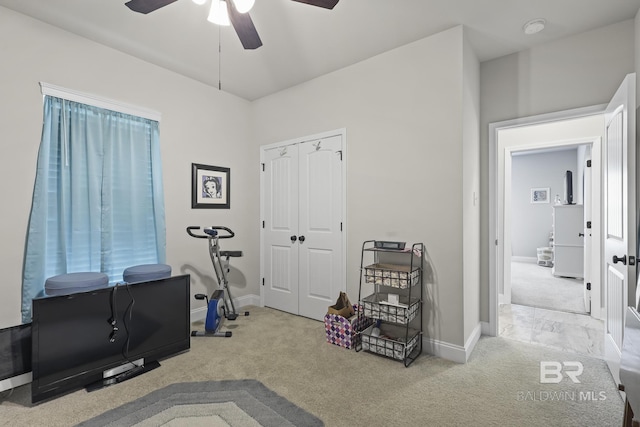 interior space with light carpet and ceiling fan