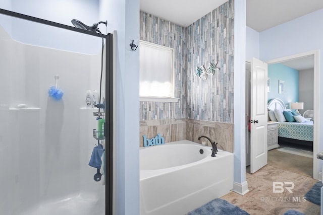 bathroom with shower with separate bathtub