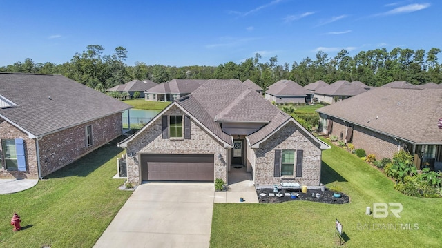 view of front of property with a garage and a front lawn