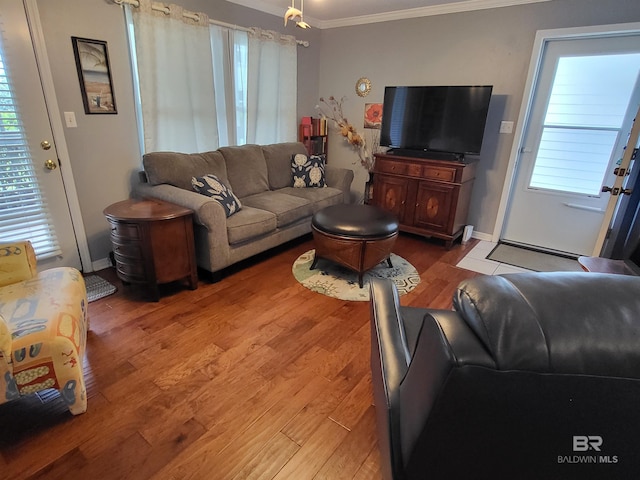 2200 W 2nd St Unit B-106, Gulf Shores, AL 36542 - living room with ornamental molding, light wood-style floors, and baseboards