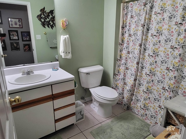 2200 W 2nd St Unit B-106, Gulf Shores, AL 36542 - bathroom featuring toilet, tile patterned floors, vanity, and a shower with shower curtain