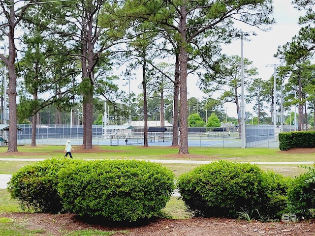 2200 W 2nd St Unit B-106, Gulf Shores, AL 36542 - view of community with a tennis court and fence