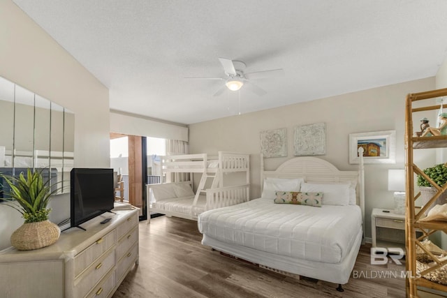 bedroom with a ceiling fan and wood finished floors
