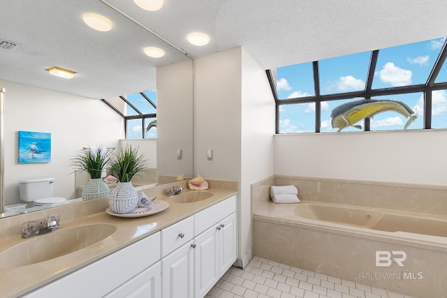 full bathroom with tile patterned flooring, a sink, double vanity, and toilet