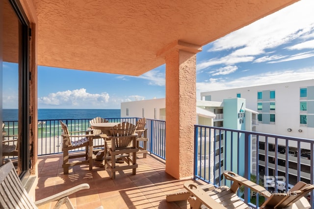 balcony featuring a water view