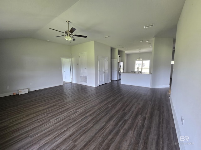 23035 Ridgewood Dr, Robertsdale, AL 36567 - unfurnished living room featuring ceiling fan, dark wood finished floors, and vaulted ceiling