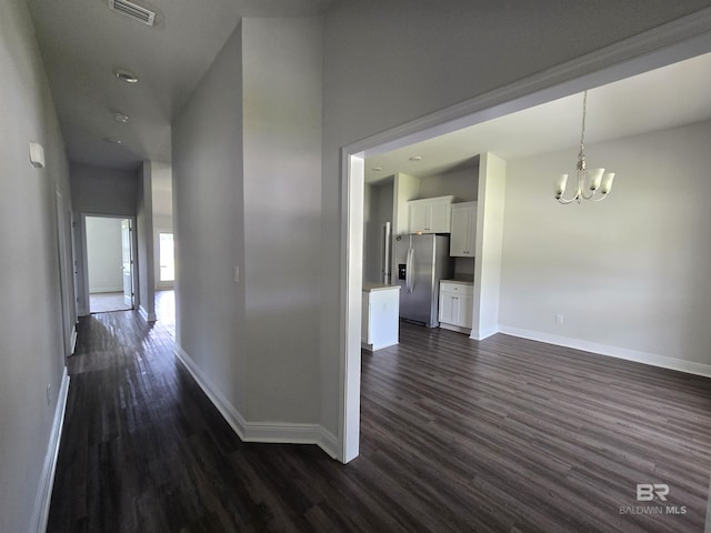 23035 Ridgewood Dr, Robertsdale, AL 36567 - hallway featuring dark wood-style floors, a chandelier, and recessed lighting
