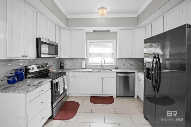 kitchen featuring a sink, crown molding, stainless steel appliances, and white cabinetry