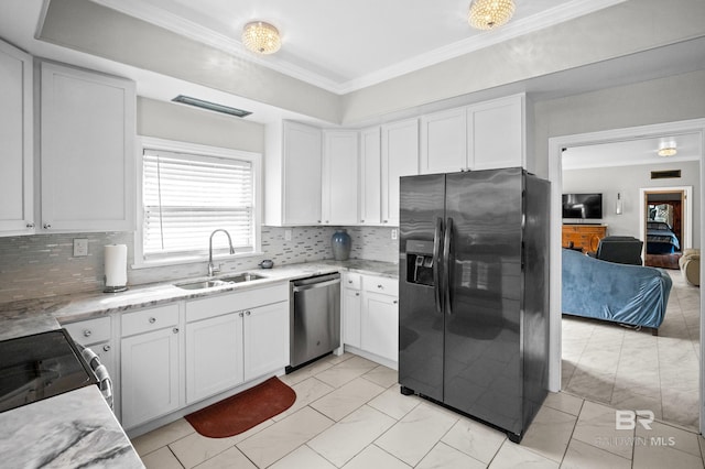 kitchen featuring marble finish floor, light stone countertops, a sink, dishwasher, and black fridge